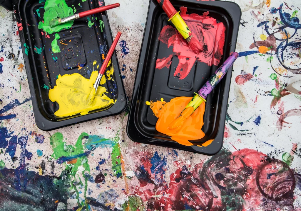 Young artists should use tempera paints because they’re strong and thick, typically washable and non-permanent. They work well on paper, canvas, and cardboard, are usually affordable and are kid-safe.